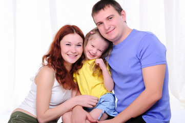 mother, a young father and young daughter