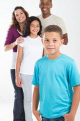 Obraz premium young boy with happy family in background