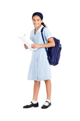 happy school student holding backpack and books