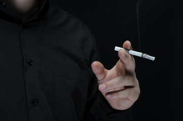 young man smokes a cigarette