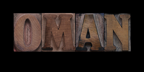 the word Oman in old letterpress wood type