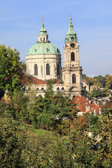 Fototapeta na wymiar View on the autumn Prague St. Nicholas' Cathedral