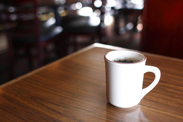 Coffee mug on table at a restaurant bar