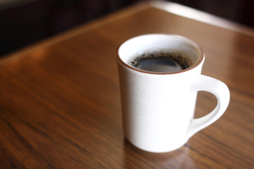 Coffee mug on table at a restaurant bar