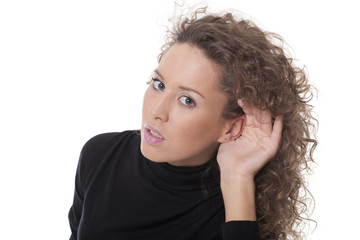 woman with hand on her ear