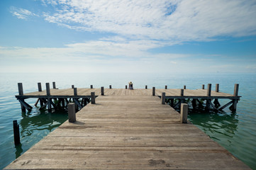 woman relaxing at the dock wide angle