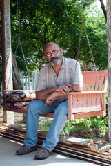 Country Man on Porch Swing