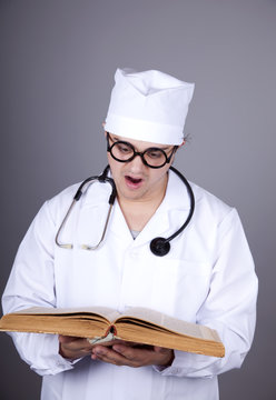 Young doctor with book.