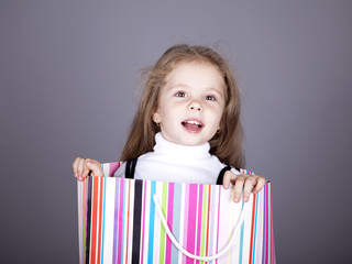 Little girl in shopping box.