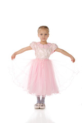 Naklejka premium little girl in a pink elegant dress.White background