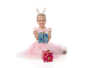 little girl in a pink dress with ears of a rabbit on a head