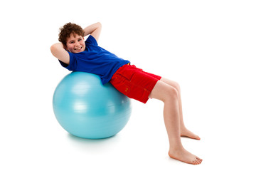 Active boy exercising on white background