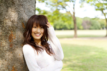 a portrait of young woman in the park