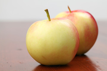 Colorful organic apples on a table. Shallow dof