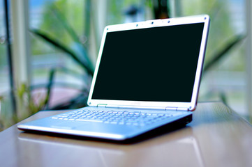 Fototapeta premium thin laptop on office desk