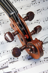 Violin Scroll on Sheet Music © Stuart