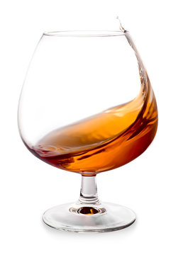 Cognac splashes in a glass