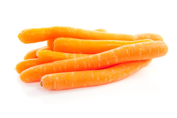 pile of fresh carrots over white background