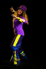 Obraz premium young female dancing on the black background