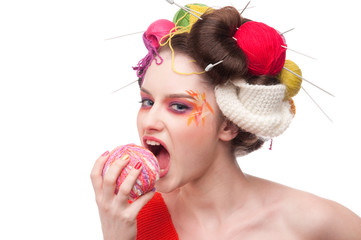 Closeup fashion woman with color face art in knitting style