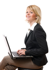 young smiling businesswoman working with laptop