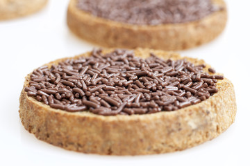Close up chocolate sprinkles on toast.