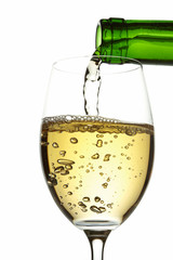 White wine pouring into glass