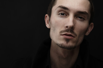Young man's portrait. Close-up face.