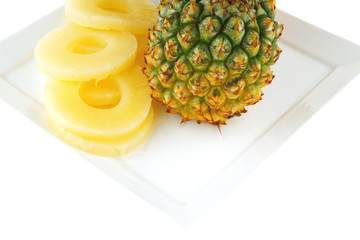 fresh ripe pineapples on plate
