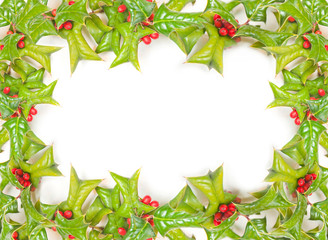 Christmas framework with holly berry isolated on white