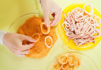 Cook breading calamaries. Stages of cooking  squid  in series © JackF