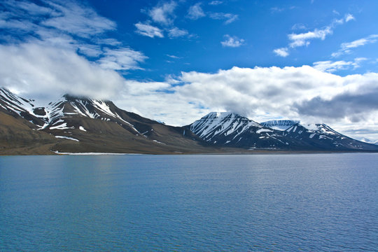 coastline with mountains in the arctic ocean