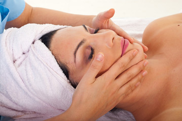 Fototapeta na wymiar Woman get facial massage at spa