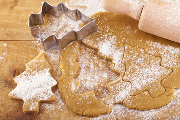 christmas gingerbread tree cookies with cutter , dough and rolli