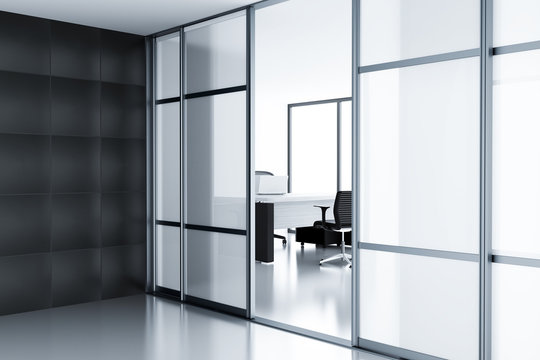 Empty cubicle behind a glass doors in modern office