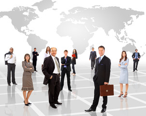 Businessmen standing in front of an earth map