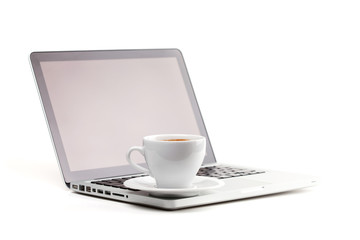 Fototapeta na wymiar Cappuccino cup on laptop