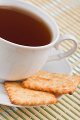 Cup of tea with crackers