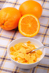 Fototapeta na wymiar Cornflakes and oranges