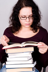 woman with stack of books