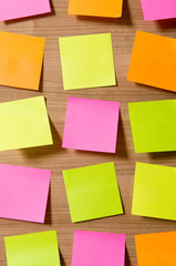 Many reminder notes on the wooden background