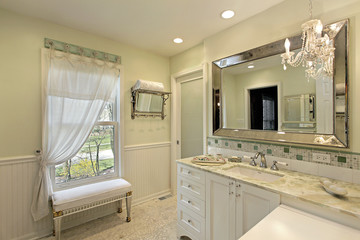 Bathroom with white cabinetry