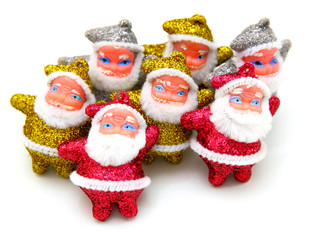 Some dolls of Santa Claus are together