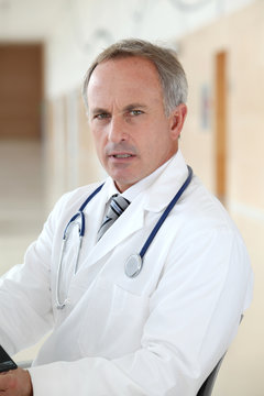 Closeup of doctor sitting in his office