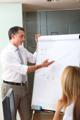 Group of people attending business presentation