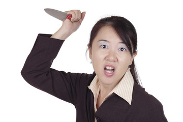 An angry Asian businesswoman holding a knife