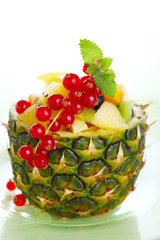 Fresh salad of tropical fruits and berries (pineapple, kiwi, pea