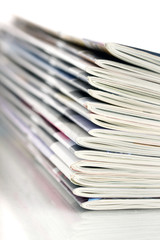 closeup pile of magazines