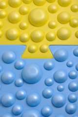 Two multi-colored parts are connected