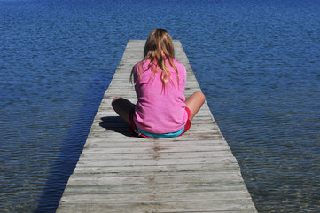 Girl Sitting on Dock